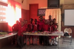 KMF donations to schools in Grenada with Volunteer Mary Williams