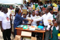 Kay donate books to Liberian refugee children at St Gregory Elementary